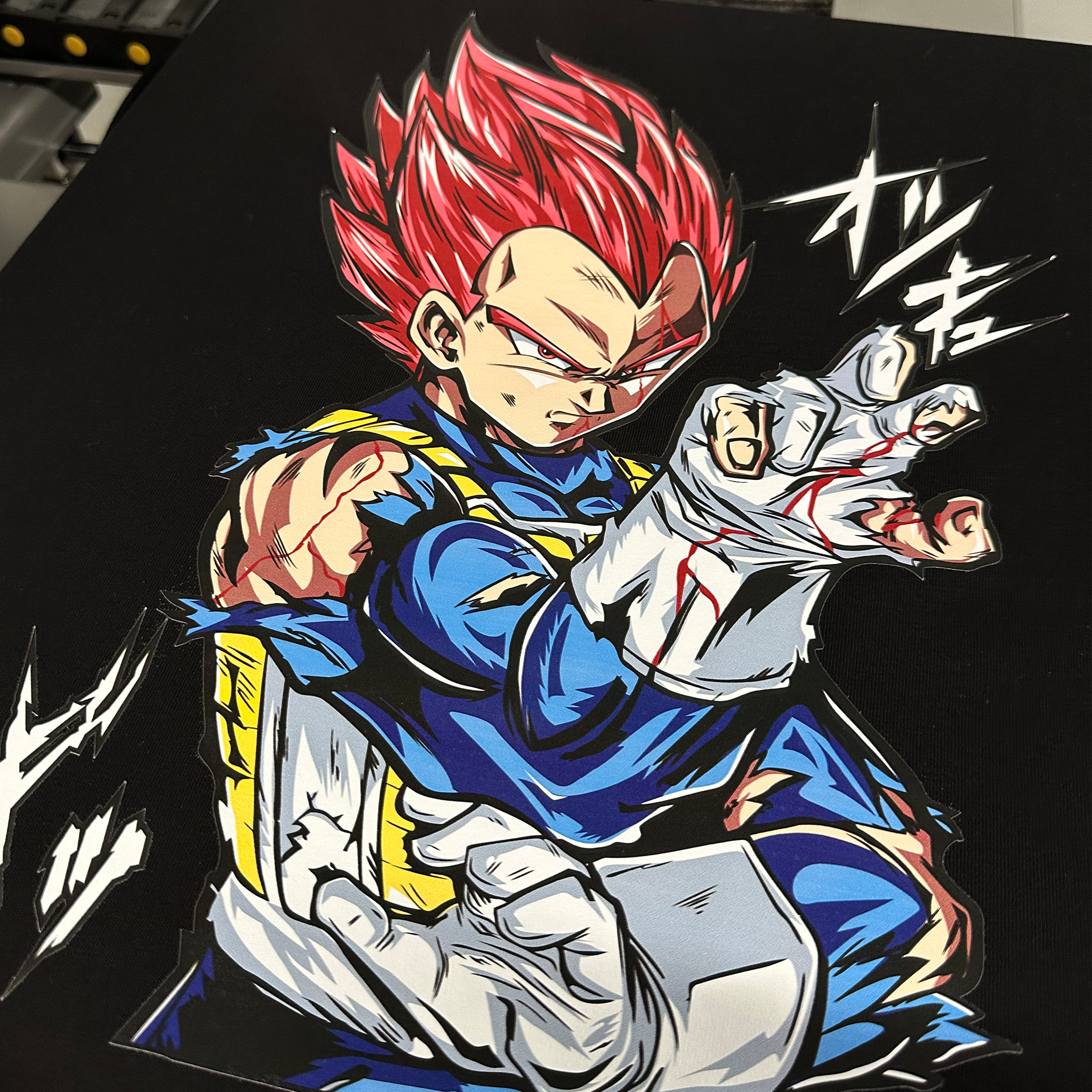 “T-shirt on a heat press featuring a printed design made with Shinobi Transfers’ DTF technology.